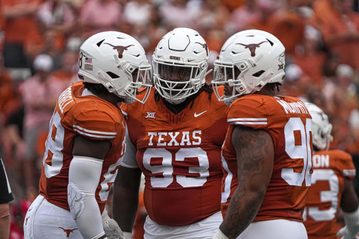 Texas Longhorns defensive lineman T'Vondre Sweat (93), center, huddles with teammates during the game against Kansas State at Royal-Memorial Stadium on Saturday, Nov. 4, 2023 in Austin.